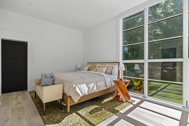 bedroom with light wood finished floors