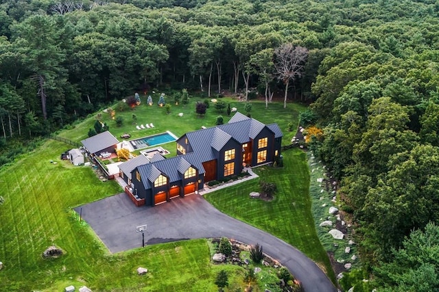 drone / aerial view with a view of trees