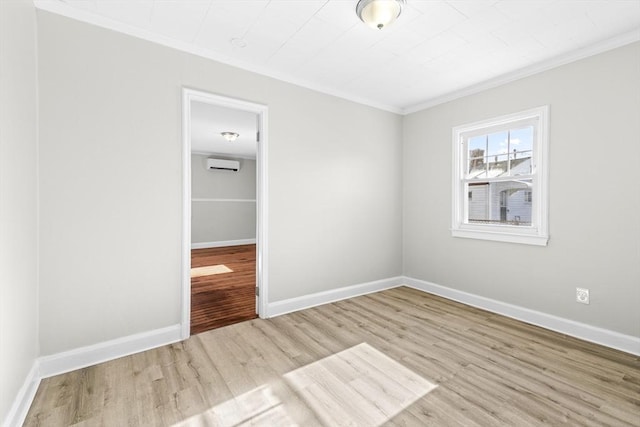 unfurnished bedroom with light hardwood / wood-style flooring, ornamental molding, and an AC wall unit