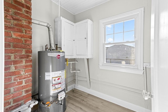 utility room with gas water heater