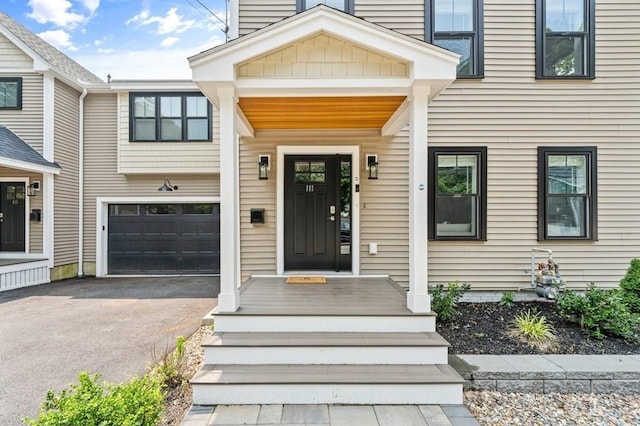 view of exterior entry featuring a garage