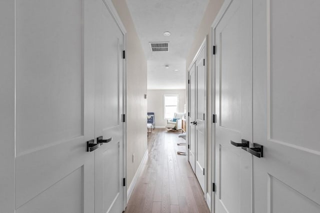 hallway featuring light hardwood / wood-style floors