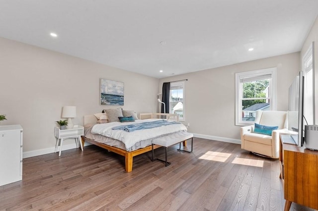 bedroom with hardwood / wood-style flooring