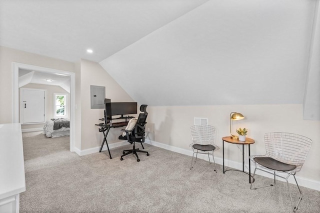 office featuring light carpet, electric panel, and lofted ceiling