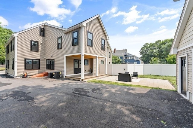 rear view of property with a patio area