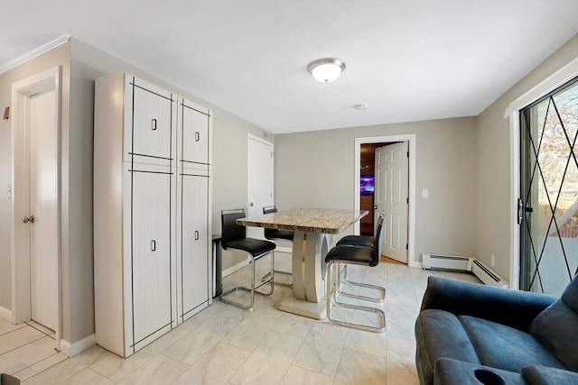 dining room featuring a baseboard heating unit