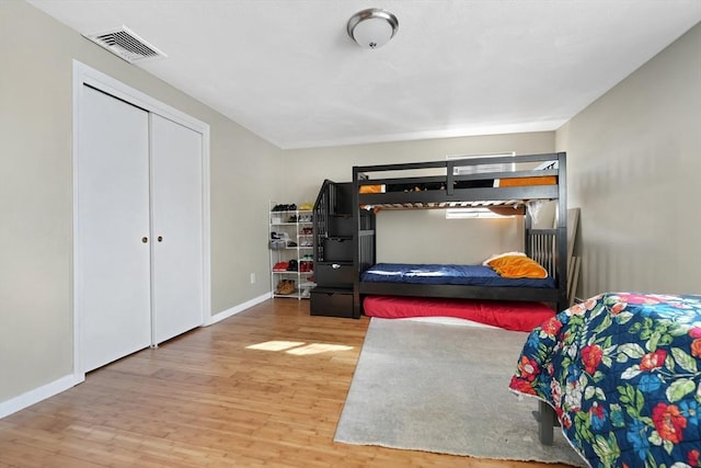 bedroom with wood-type flooring