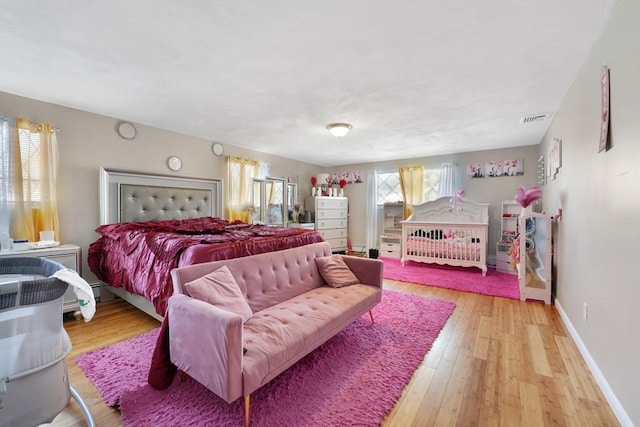 bedroom with light hardwood / wood-style flooring