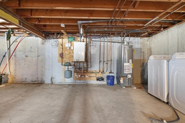 basement featuring gas water heater and washer and clothes dryer