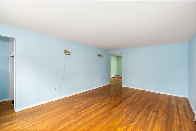 8 Grandview St, South Hadley, MA 01075 - unfurnished room with wood finished floors and a baseboard radiator