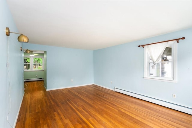 8 Grandview St, South Hadley, MA 01075 - spare room featuring a baseboard radiator and wood finished floors