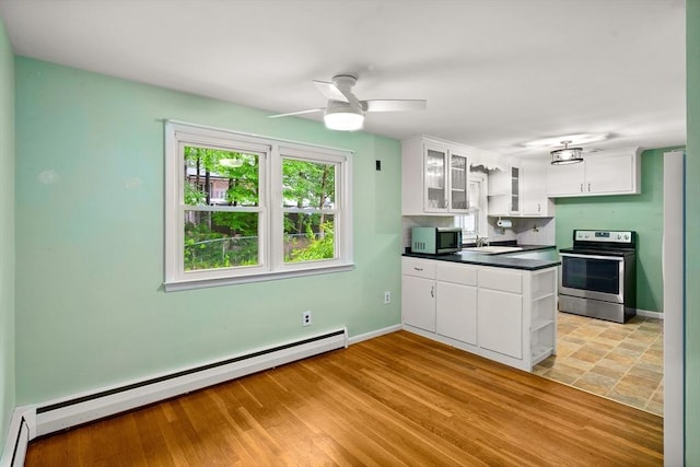 8 Grandview St, South Hadley, MA 01075 - kitchen with appliances with stainless steel finishes, baseboard heating, open shelves, and dark countertops