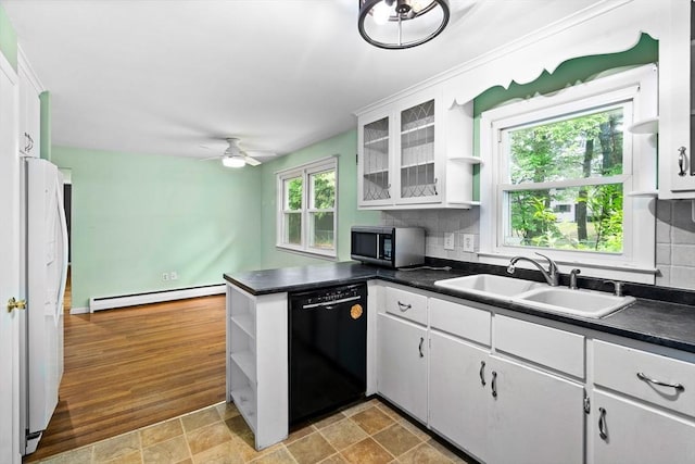 8 Grandview St, South Hadley, MA 01075 - kitchen with black dishwasher, baseboard heating, open shelves, stainless steel microwave, and dark countertops
