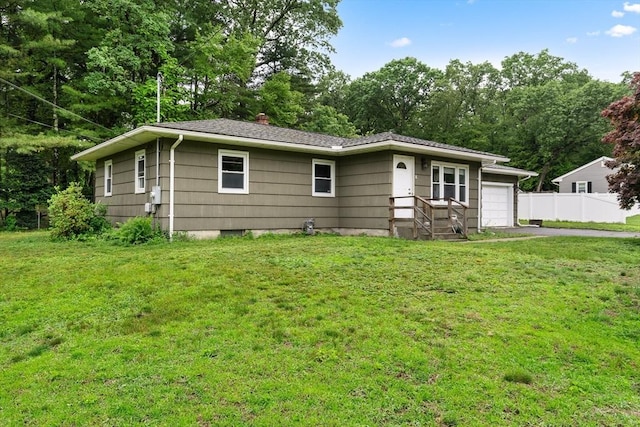 8 Grandview St, South Hadley, MA 01075 - ranch-style house featuring asphalt driveway, a chimney, an attached garage, and view of wooded area