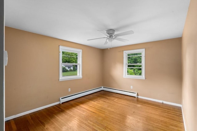 8 Grandview St, South Hadley, MA 01075 - unfurnished room featuring a baseboard heating unit, plenty of natural light, a ceiling fan, and hardwood / wood-style floors