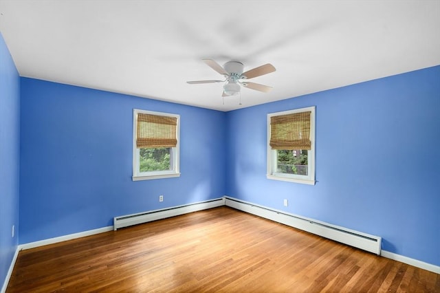 8 Grandview St, South Hadley, MA 01075 - unfurnished room with a baseboard heating unit, plenty of natural light, and wood finished floors