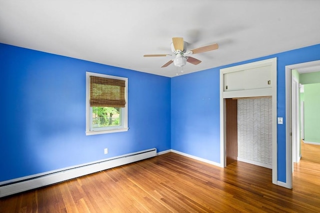8 Grandview St, South Hadley, MA 01075 - unfurnished bedroom with a baseboard heating unit, wood finished floors, and a ceiling fan