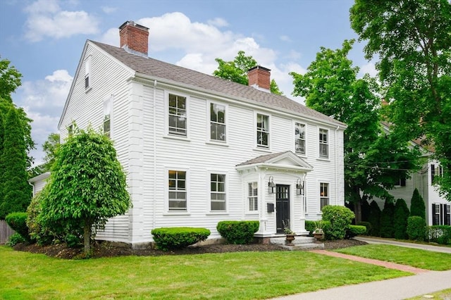 651 Main St, Hingham, MA 02043 - colonial inspired home featuring a chimney and a front lawn