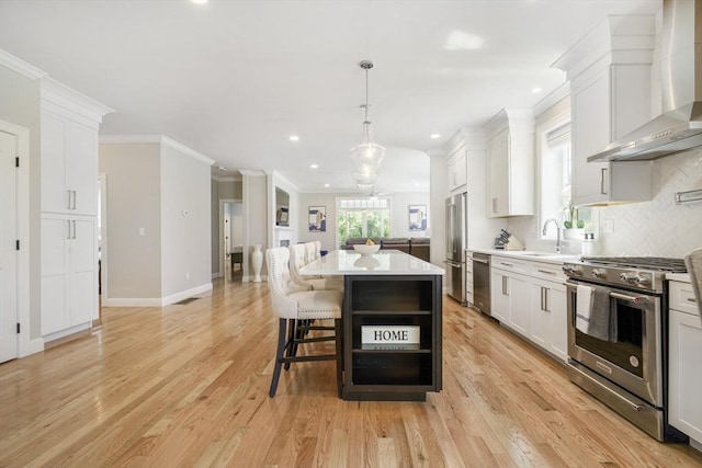 57 Sophia Dr, Rehoboth, MA 02769 - kitchen featuring recessed lighting, a sink, high end appliances, wall chimney exhaust hood, and a kitchen island