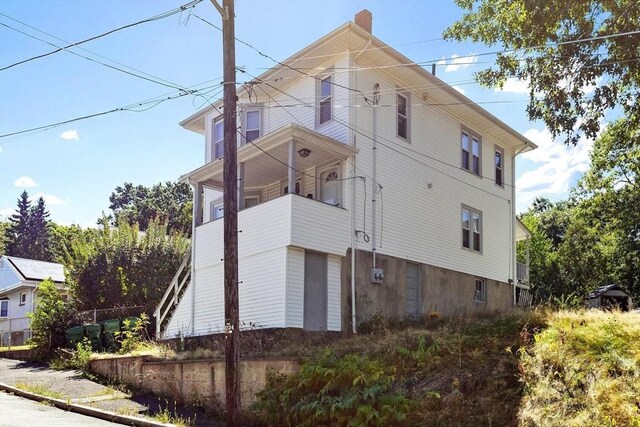 view of home's exterior featuring a balcony