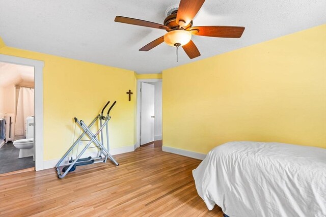 112 Lawrence St, Fitchburg, MA 01420 - bedroom with light wood-style floors, baseboards, connected bathroom, and a ceiling fan