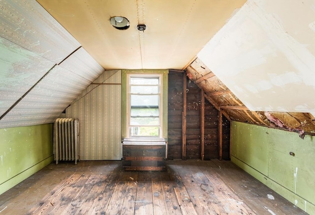 112 Lawrence St, Fitchburg, MA 01420 - additional living space featuring radiator heating unit, hardwood / wood-style flooring, and vaulted ceiling