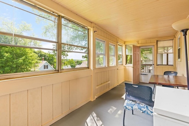 112 Lawrence St, Fitchburg, MA 01420 - sunroom with concrete floors and wooden ceiling