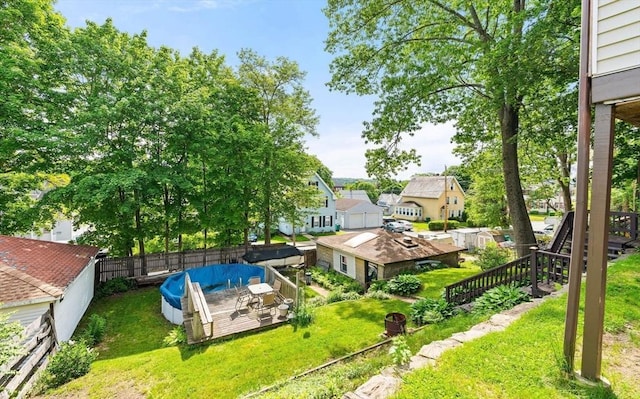112 Lawrence St, Fitchburg, MA 01420 - view of yard featuring a wooden deck and a residential view