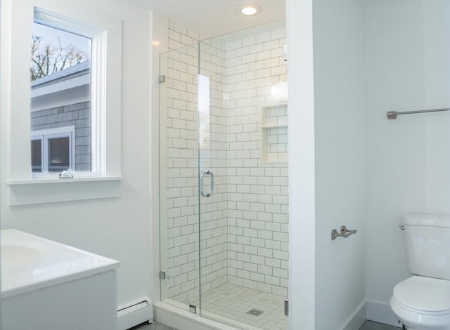 bathroom featuring an enclosed shower, vanity, toilet, and baseboard heating