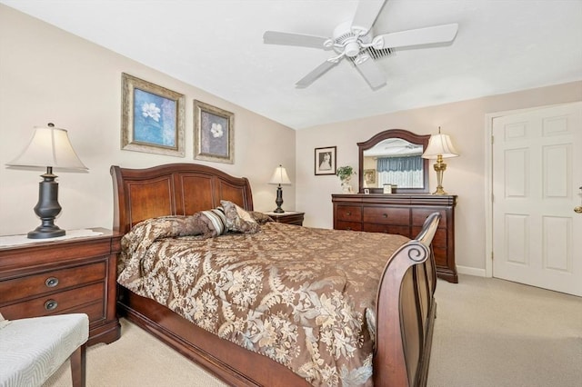 bedroom featuring baseboards, a ceiling fan, and light colored carpet