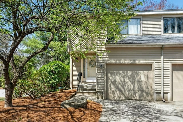 view of front facade featuring concrete driveway and an attached garage