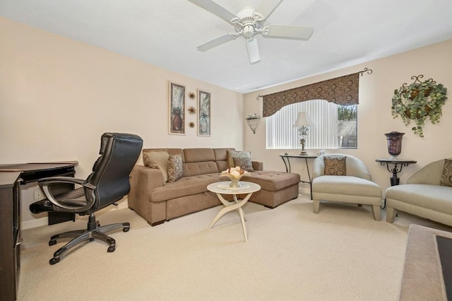 carpeted living area featuring ceiling fan
