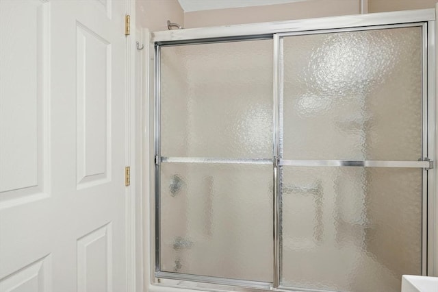 full bathroom with a shower with door