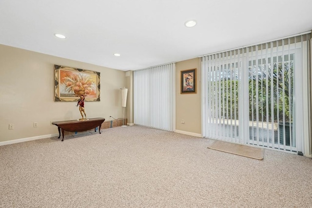 interior space with carpet, recessed lighting, and baseboards