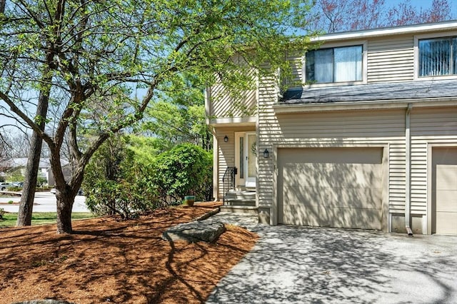 view of front of house featuring aphalt driveway and an attached garage