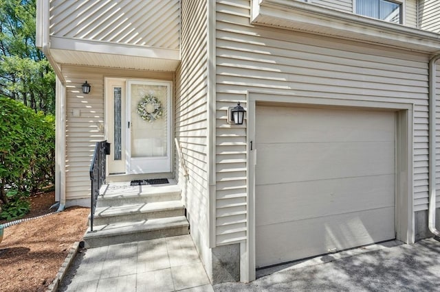 view of exterior entry with a garage