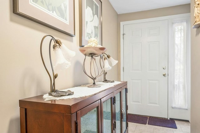 foyer entrance featuring light tile patterned floors