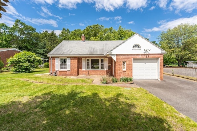 405 Granby Rd, South Hadley, MA 01075 - view of front of property with brick siding, an attached garage, asphalt driveway, and a chimney