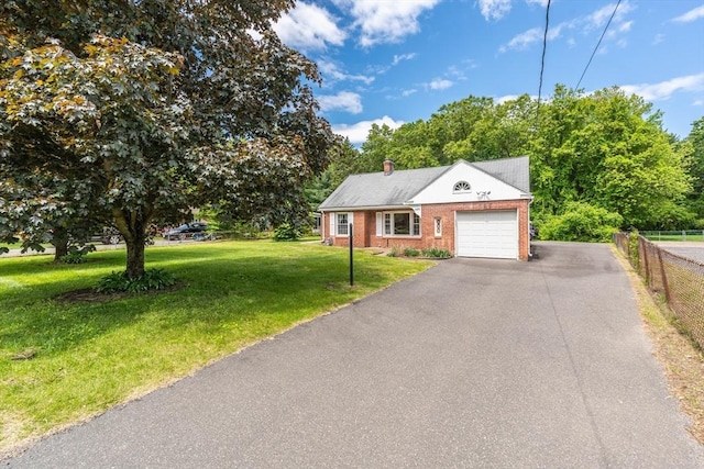 405 Granby Rd, South Hadley, MA 01075 - view of front of property with a garage, brick siding, and driveway