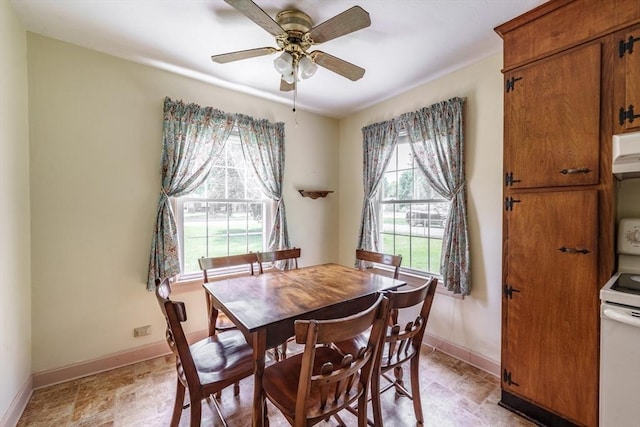405 Granby Rd, South Hadley, MA 01075 - dining area featuring baseboards and ceiling fan