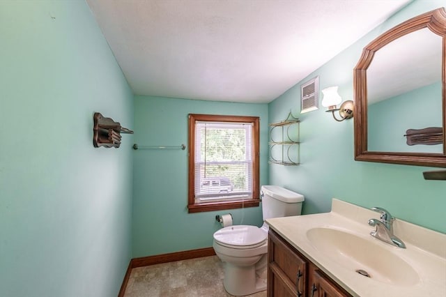 405 Granby Rd, South Hadley, MA 01075 - bathroom with toilet, vanity, and baseboards