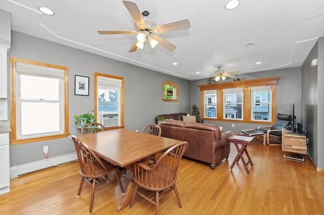 dining space with recessed lighting, cooling unit, baseboards, and light wood-style floors