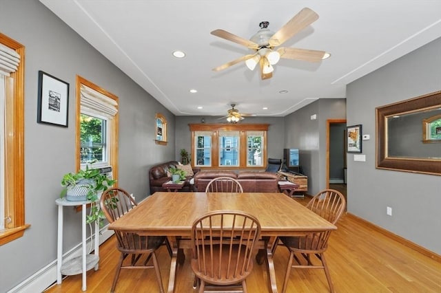 dining room featuring recessed lighting, baseboards, light wood finished floors, and a baseboard radiator