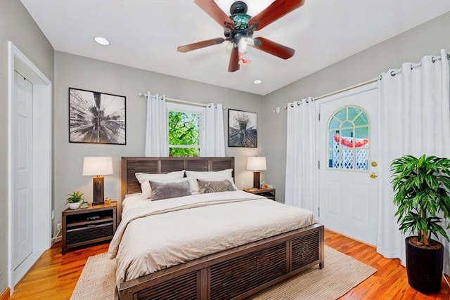 bedroom with recessed lighting, light wood-type flooring, and a ceiling fan