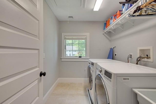 122 Crescent Rd, Concord, MA 01742 - washroom with attic access, washing machine and dryer, and light tile patterned floors