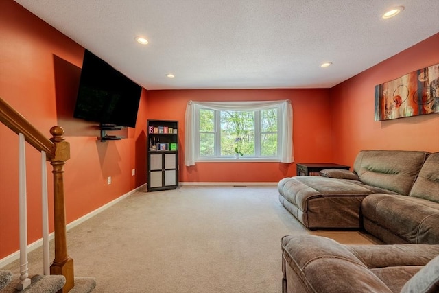living room featuring recessed lighting, carpet, baseboards, stairs, and a textured ceiling