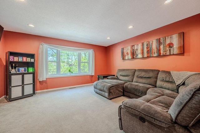 carpeted living room with baseboards and recessed lighting