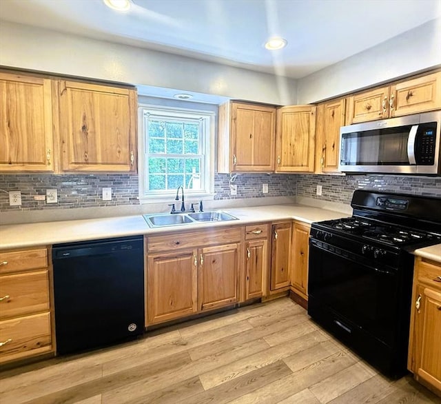 6 Debbie Ln, Freetown, MA 02702 - kitchen featuring black appliances, light countertops, decorative backsplash, and light wood-style floors