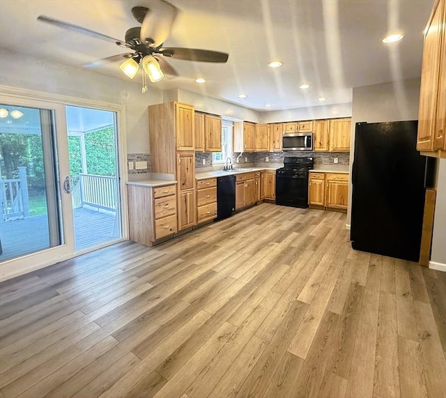 6 Debbie Ln, Freetown, MA 02702 - kitchen with black appliances, light countertops, plenty of natural light, and ceiling fan