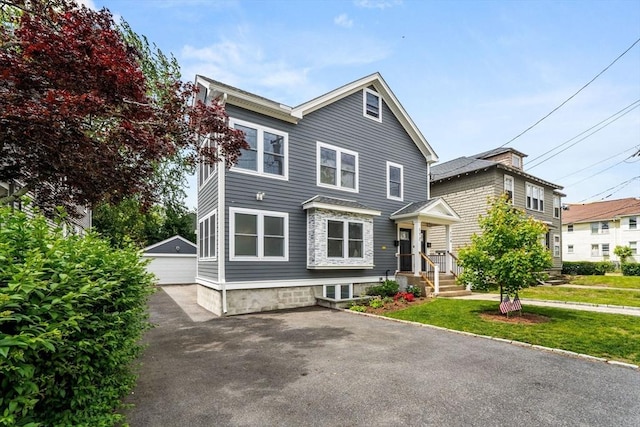 172 Orchard St Unit 172, Watertown, MA 02472 - view of front of home featuring an outbuilding, a garage, and a front yard